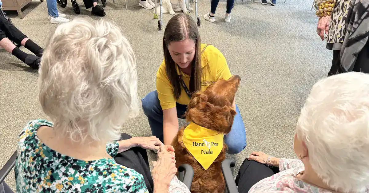 Nicole and her Therapy Dog Nala visit with seniors at Kirkwood by the River