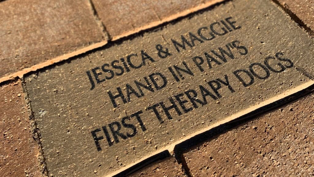 Plaque honoring Jessica and Maggie, Hand in Paw's first therapy dogs.