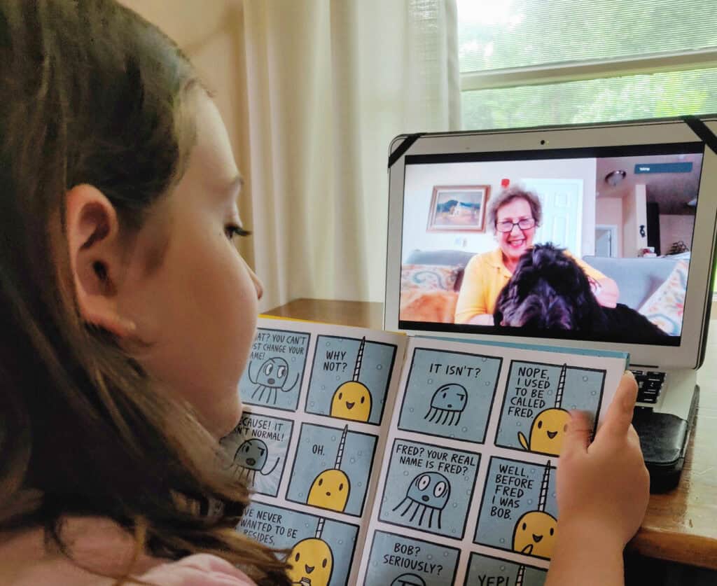 Ava Reads to Maggie